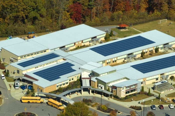Metal roof installation on a school building by Robertson Roofing in Fort Myers