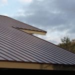 Fort Myers home featuring a newly installed metal roof by Robertson Roofing, highlighting accessibility and durability.