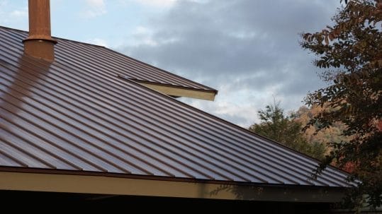 Fort Myers home featuring a newly installed metal roof by Robertson Roofing, highlighting accessibility and durability.