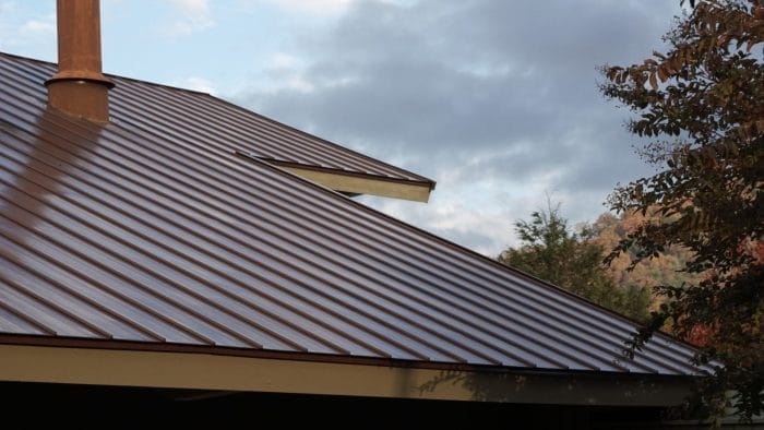 Fort Myers home featuring a newly installed metal roof by Robertson Roofing, highlighting accessibility and durability.