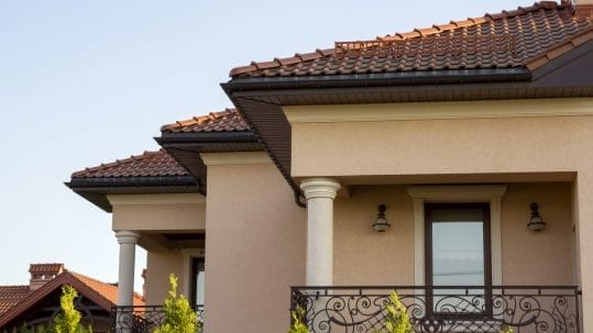 Tile roof installation on a Mediterranean-style home by Robertson Roofing in Fort Myers