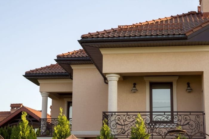 Tile roof installation on a Mediterranean-style home by Robertson Roofing in Fort Myers