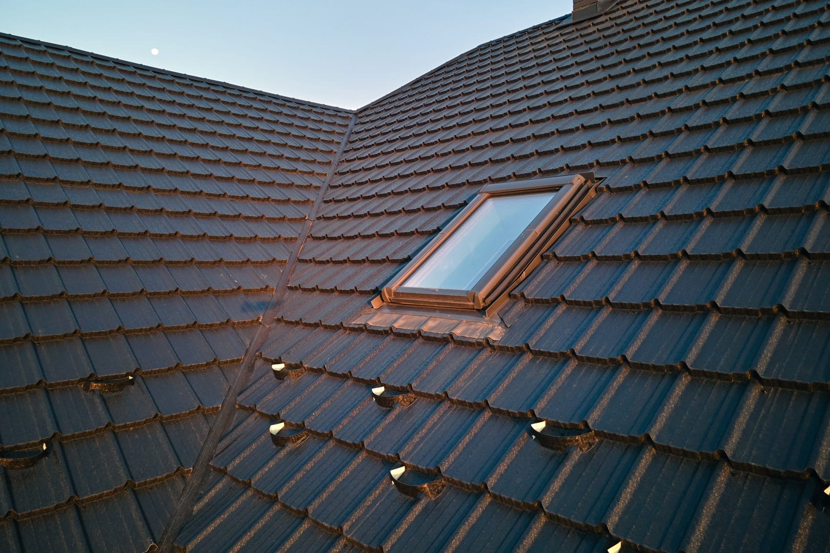 Repaired tile roof skylight frame by Robertson Roofing in Fort Myers