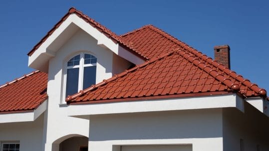 Modern home featuring a stylish tile roof installed by Robertson Roofing in Fort Myers, Florida.