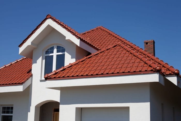 Modern home featuring a stylish tile roof installed by Robertson Roofing in Fort Myers, Florida.