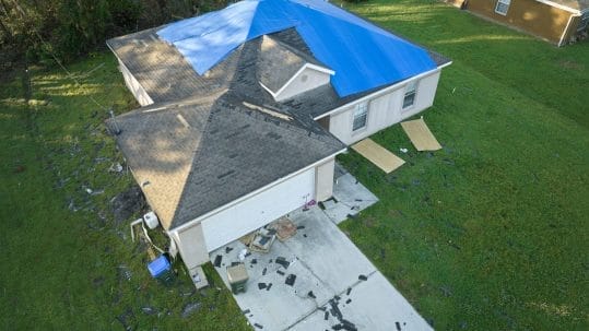 Sustainable roofing installation in Fort Myers using eco-friendly tile materials after storm damage replacement by Robertson Roofing.