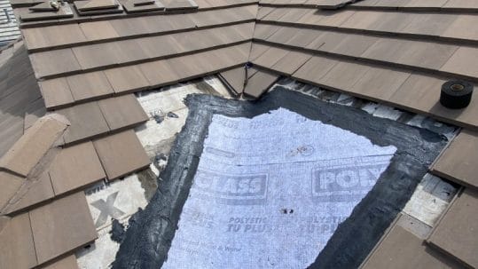 Robertson Roofing expert repairing shingle roof blow-off in Fort Myers