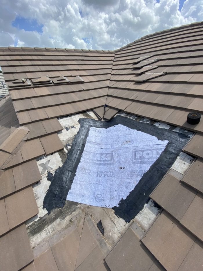 Robertson Roofing expert repairing shingle roof blow-off in Fort Myers